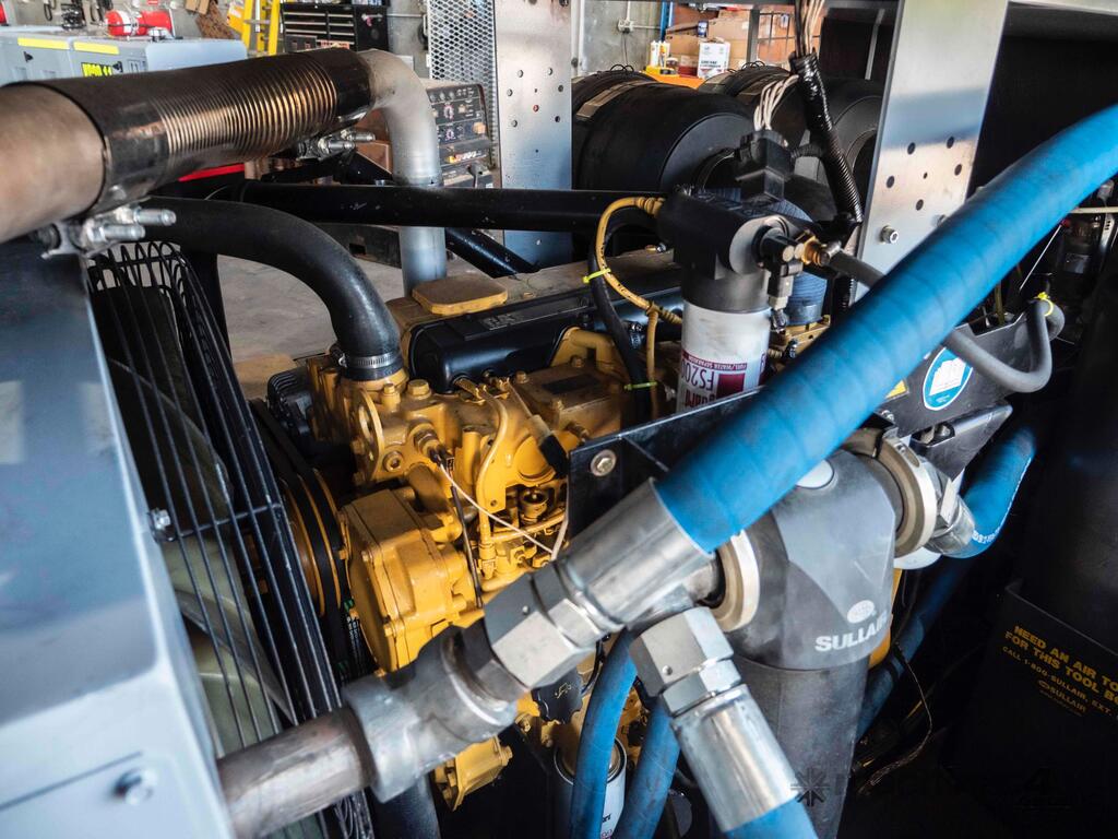 Kirbtech technician servicing an industrial air compressor
