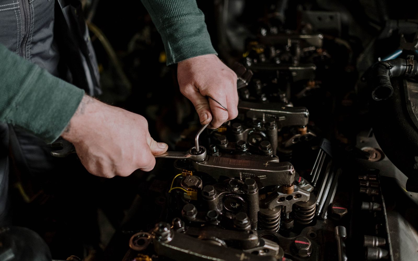Kirbtech technician inspecting a replacement component during an equipment repair.